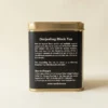 Darjeeling Black Tea 100gm Tin Box With Side view of tin box with Description